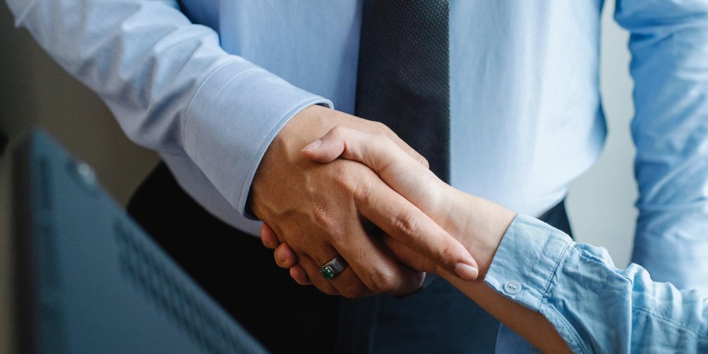 Two business people shaking hands