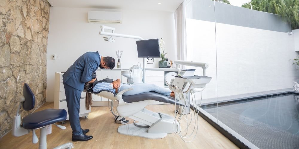 Dentist with a patient in a chair