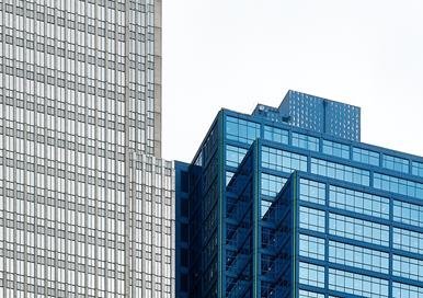 Blue exterior building behind a gray one