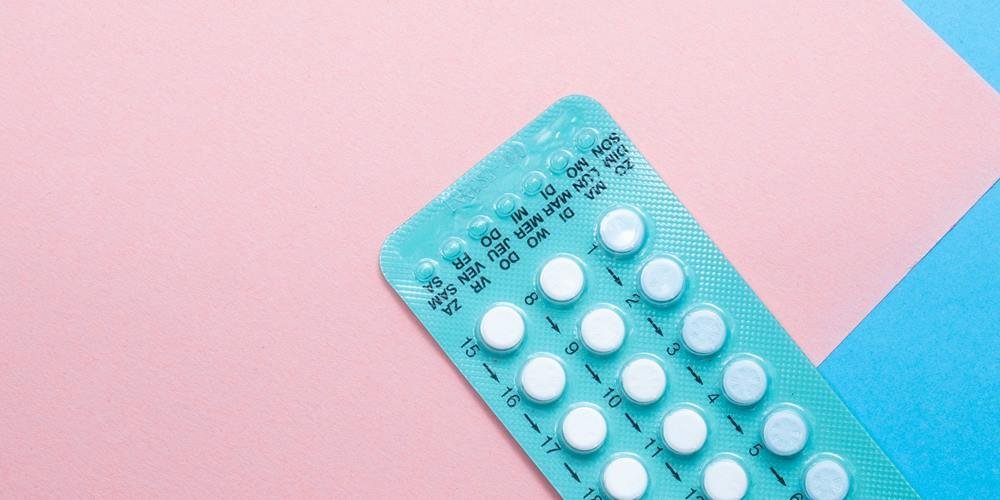 Pills on a blue and pink background