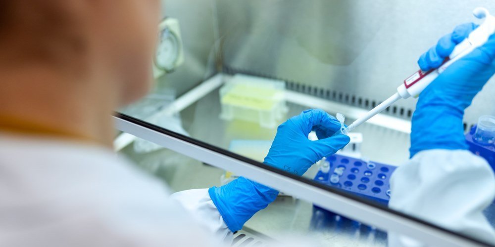 A lady performing testing in a laboratory