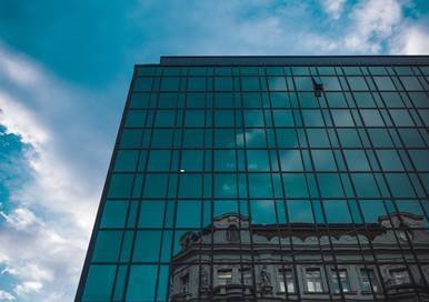 Large office building with a reflection on it