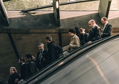 People going down on an escalator