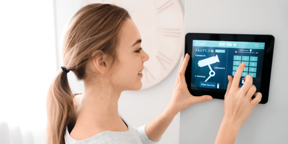 woman controlling a smart home on a tablet