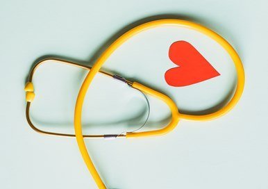 A yellow stethoscope and a heart