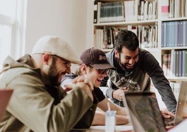 Young men in the office, laughing